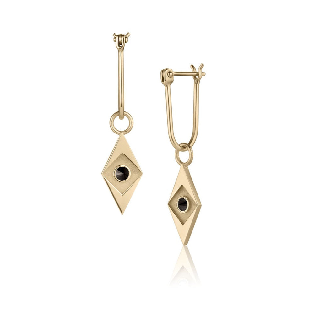 Gold earrings with diamond-shaped design and black stones on a white background