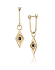 Gold earrings with diamond-shaped design and black stones on a white background