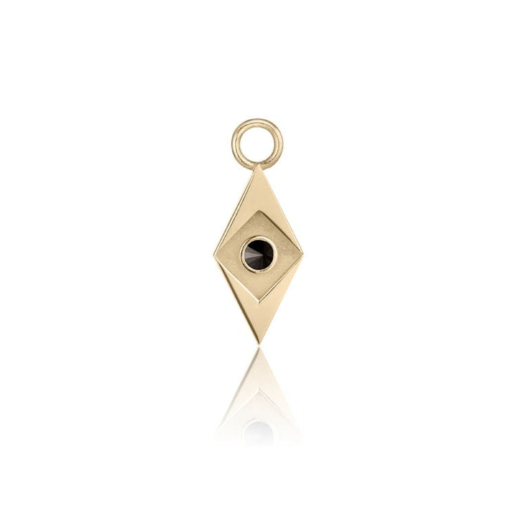 Gold pendant with a black gemstone on a white background