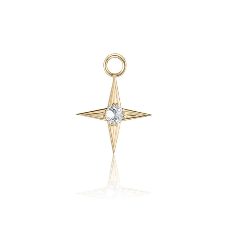 Gold star-shaped pendant with a diamond on a white background