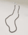silver bead necklace on silver chain