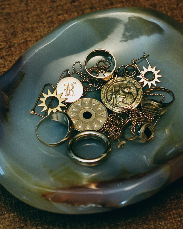 film photo of EMBLM Fine Jewelry in a bowl