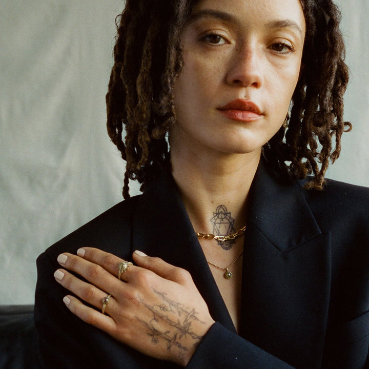 model wearing emblm fine jewelry in a film image