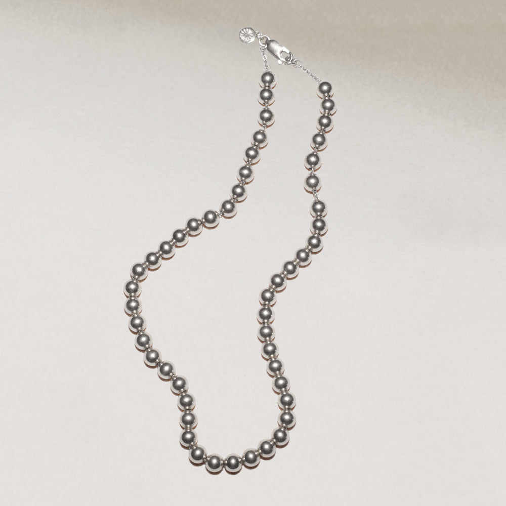 silver bead necklace on silver chain